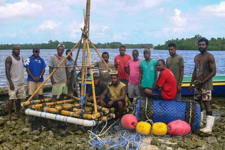 Group of Solomon Islands men of Uhu in West Are'are, Malaita Province, prepare to put a FAD to sea. It is to help maintain livelihoods during COVID-19 restrictions. Photo by Mathew Isihanua.