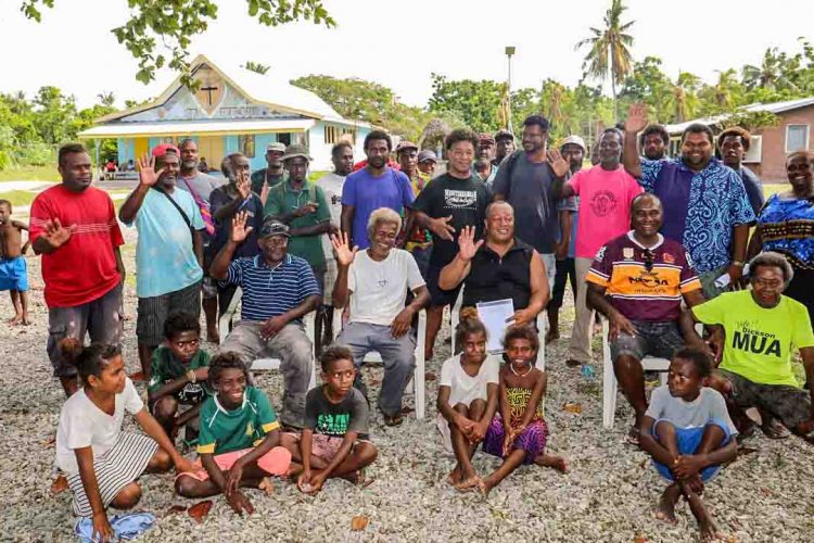 Members and families of newly formed Russell Islands Fisheries Assocation, on a beach in Solomon Islands. Photo: Solomon Islands Government Communications Unit.