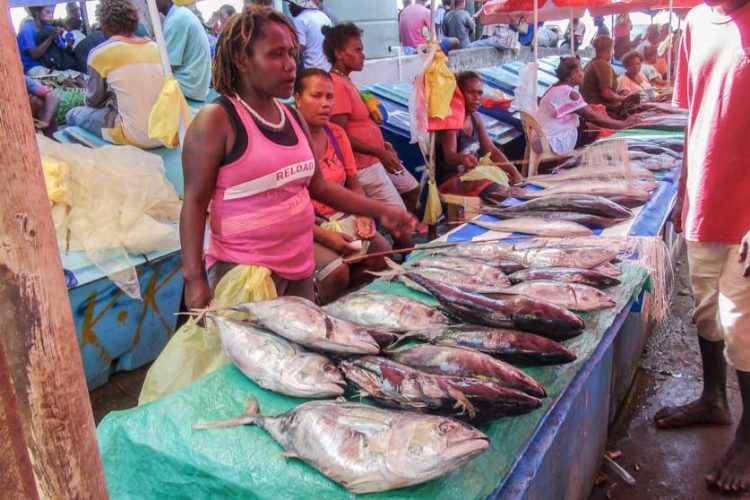 Women at market stalls sell fish at Honiara Central Market, Solomon Islands. Photo Ronald Toito’ona.