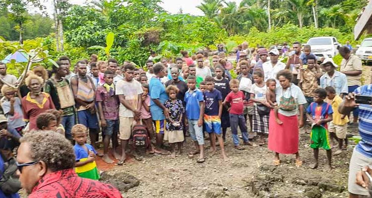 Large group of women, men and children at beneficiary mapping for tribal landowners at Bina Harbour, Malaita, Solomon Islands