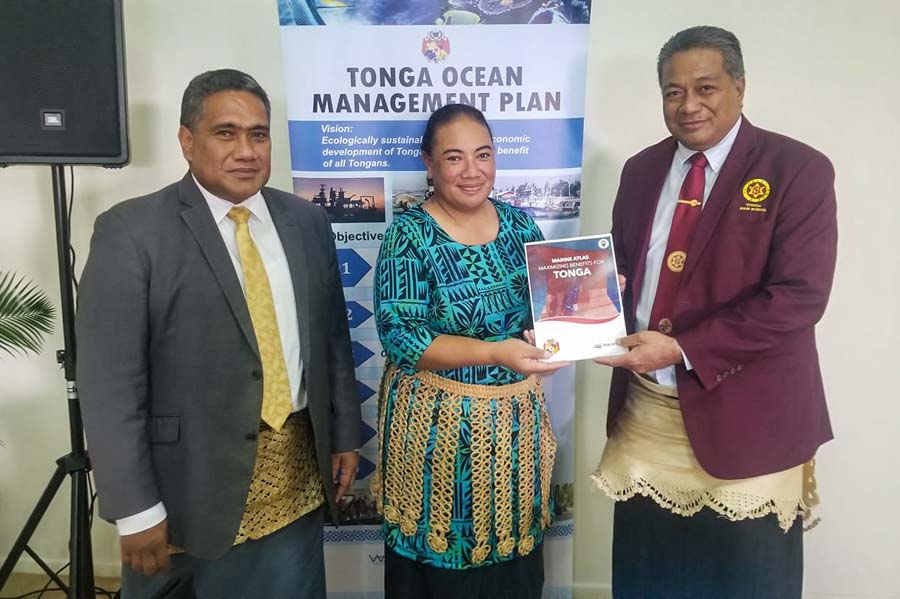 At Tonga World Oceans Day 2021, left to right, chief executive officer for MEIDECC, Mr Paula Ma’u; Director of Environment, Ms Atelaite Lupe Matoto; and Minister for Environment, Hon. Poasi Tei, with Tonga marine atlas. Photo: Iliesa Tora.