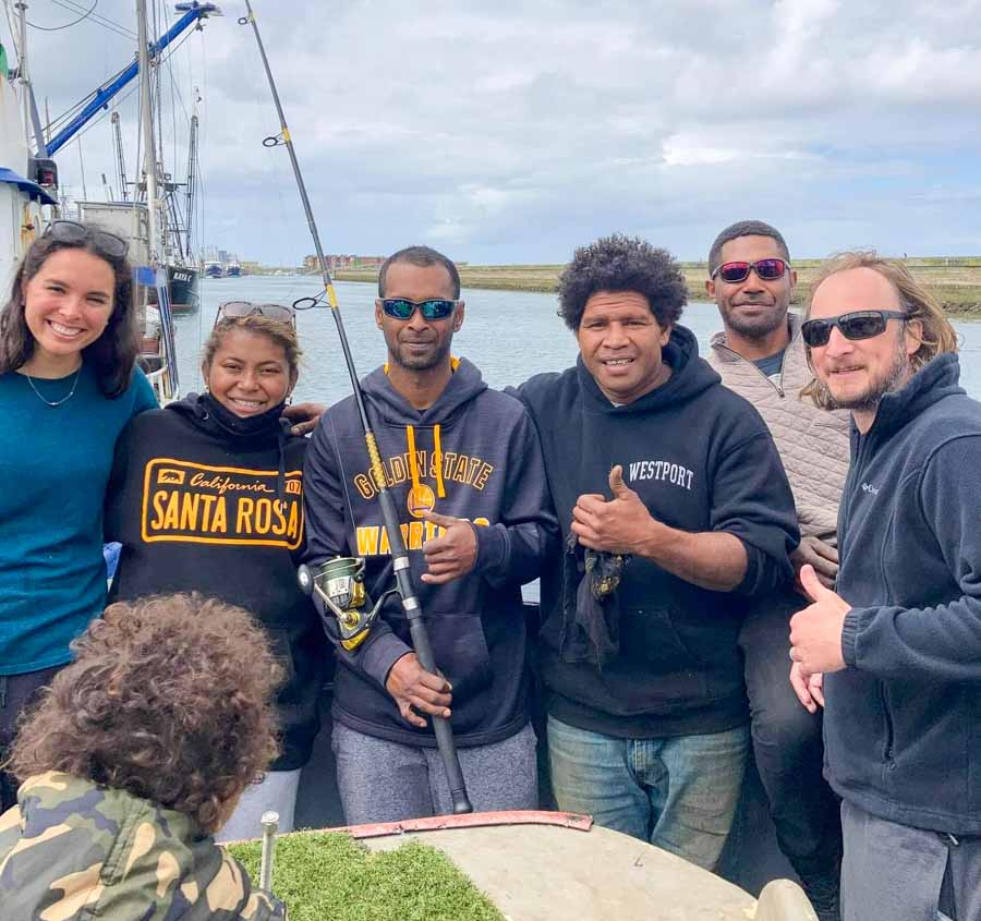 Esther Wozniak with brother and cousins from Fiji on albacore fishing vessel moored in Seattle, USA